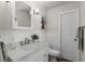 Bathroom featuring a white vanity with a single sink and decorative accents at 8625 Vista Point Cv, Orlando, FL 32836