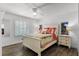 Inviting bedroom with colorful bedding, shuttered windows, and abundant natural light at 8625 Vista Point Cv, Orlando, FL 32836
