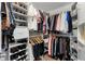 Walk-in closet with shelving, clothing rods and ample storage space at 8625 Vista Point Cv, Orlando, FL 32836