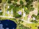 Ared view of home, lot lines, lake, trees and landscaping at 9642 Florida Boys Ranch Rd, Clermont, FL 34711
