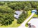 Aerial shot of home showing new roof, adjacent building and lots of trees and landscaping at 9642 Florida Boys Ranch Rd, Clermont, FL 34711