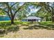 Large backyard with mature trees, lush lawn, and ample space for outdoor activities and enjoyment at 9642 Florida Boys Ranch Rd, Clermont, FL 34711