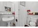 Charming bathroom featuring a pedestal sink, and classic fixtures offers a vintage appeal at 9642 Florida Boys Ranch Rd, Clermont, FL 34711