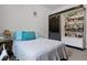 Bedroom with a gray sliding door, built in bookcase, and a comfortable bed at 9642 Florida Boys Ranch Rd, Clermont, FL 34711