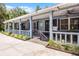 Inviting covered front porch with ample seating, ceiling fans, and charming details, perfect for relaxing outdoors at 9642 Florida Boys Ranch Rd, Clermont, FL 34711
