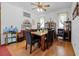 Traditional dining room with hardwood floors, chandelier, and decorative shelving offers a cozy place to gather at 9642 Florida Boys Ranch Rd, Clermont, FL 34711
