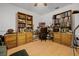 Organized office space with built-in shelving, perfect for a home workspace or study area at 9642 Florida Boys Ranch Rd, Clermont, FL 34711
