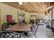 Spacious covered patio with seating, a dining area, and great natural light, perfect for relaxation at 9642 Florida Boys Ranch Rd, Clermont, FL 34711