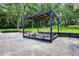 Outdoor seating area with a covered pergola, ideal for relaxing in the shade at 9642 Florida Boys Ranch Rd, Clermont, FL 34711