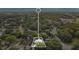 Highlighted aerial view showcases a property surrounded by lush greenery and mature trees at 1148 Northcrest Dr, Apopka, FL 32703