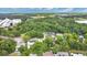A peaceful aerial view of homes nestled in a mature tree canopy at 1148 Northcrest Dr, Apopka, FL 32703