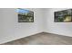 Bright bedroom featuring wood-look floors, white walls and natural light at 1148 Northcrest Dr, Apopka, FL 32703
