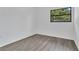 Inviting bedroom with wood-look floors, white walls and plenty of natural light at 1148 Northcrest Dr, Apopka, FL 32703