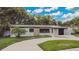 Well-maintained single-Gathering home with stone accents, fresh paint, and a paved driveway at 1148 Northcrest Dr, Apopka, FL 32703
