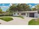 Charming single-story home with stone accents, well-manicured lawn, and a convenient driveway at 1148 Northcrest Dr, Apopka, FL 32703