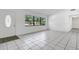 Bright, spacious living room with tile flooring and a view of the front yard at 1148 Northcrest Dr, Apopka, FL 32703