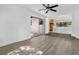 Bright living room showcasing wood-look floors and access to additional living space at 1148 Northcrest Dr, Apopka, FL 32703