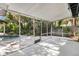 View of a screened porch that offers a transition to the outdoors with a glimpse of the pool at 1148 Northcrest Dr, Apopka, FL 32703