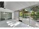 A screened porch allows an indoor/outdoor experience that overlooks the pool area with tropical landscaping at 1148 Northcrest Dr, Apopka, FL 32703