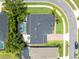 Aerial view of the home featuring a screened in pool and a patio seating area in a landscaped yard at 11850 Sheltering Pine Dr, Orlando, FL 32836