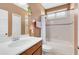 Cozy bathroom featuring shower over tub, toilet, sink, and modern fixtures at 11850 Sheltering Pine Dr, Orlando, FL 32836
