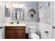 Bathroom features modern fixtures, decorative wainscoting, and bright lighting at 11850 Sheltering Pine Dr, Orlando, FL 32836