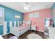 bedroom with colorful walls, decorative rug, modern lighting, and a ceiling fan at 11850 Sheltering Pine Dr, Orlando, FL 32836