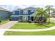 Charming two-story home with manicured lawn, a two car garage, and a covered front porch at 11850 Sheltering Pine Dr, Orlando, FL 32836