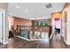 Open hallway with hardwood floors and a view of the living room at 11850 Sheltering Pine Dr, Orlando, FL 32836