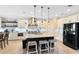 Bright kitchen with granite countertops, large island and stainless steel appliances at 11850 Sheltering Pine Dr, Orlando, FL 32836