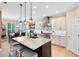 Bright kitchen with granite countertops, large island, and stainless steel appliances at 11850 Sheltering Pine Dr, Orlando, FL 32836