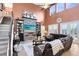Bright living room with a stone fireplace, high ceilings, and a comfortable seating area at 11850 Sheltering Pine Dr, Orlando, FL 32836