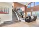 Spacious living room boasts a stone fireplace, soaring ceilings, and a comfortable seating area at 11850 Sheltering Pine Dr, Orlando, FL 32836
