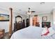 Bedroom with hardwood floors, fireplace, and a ceiling fan at 11850 Sheltering Pine Dr, Orlando, FL 32836