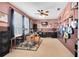 Room with drums, guitars and a ceiling fan at 11850 Sheltering Pine Dr, Orlando, FL 32836