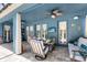 Inviting covered patio featuring a ceiling fan, outdoor seating, and views of the pool at 11850 Sheltering Pine Dr, Orlando, FL 32836
