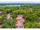 Aerial view of lush community surrounded by mature trees, near a lake at 1217 Salerno Ct # 1217, Orlando, FL 32806