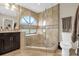 A bathroom featuring a walk-in shower with glass enclosure, and a window for natural light and ventilation at 1217 Salerno Ct # 1217, Orlando, FL 32806