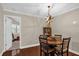 Dining area featuring modern lighting, hardwood floors, and views into the rest of the home at 1217 Salerno Ct # 1217, Orlando, FL 32806