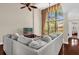 Bright living room with a large window, comfortable seating, and a view of the outdoor scenery at 1217 Salerno Ct # 1217, Orlando, FL 32806