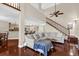 Spacious living room showcasing hardwood floors, staircase, balcony, and open floor plan at 1217 Salerno Ct # 1217, Orlando, FL 32806