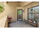 Cozy porch featuring grill, plants, outdoor decor and covered entry to the home at 1217 Salerno Ct # 1217, Orlando, FL 32806