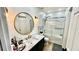 Bathroom with modern vanity, glass shower, and neutral color scheme at 12621 Tanja King Blvd, Orlando, FL 32828