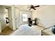 Bright bedroom featuring a ceiling fan, neutral-toned carpet, and comfortable furniture at 12621 Tanja King Blvd, Orlando, FL 32828