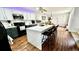Modern kitchen featuring a spacious island with seating and sleek appliances at 12621 Tanja King Blvd, Orlando, FL 32828
