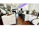 Stylish kitchen with white and navy cabinets, quartz countertops and stainless appliances at 12621 Tanja King Blvd, Orlando, FL 32828