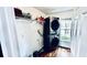 Convenient laundry room with modern, stackable washer and dryer at 12621 Tanja King Blvd, Orlando, FL 32828