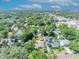 Aerial view of the property's location within a lush, green neighborhood and city skyline at 1308 Oregon St, Orlando, FL 32803