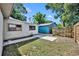 Backyard featuring a fence and a shed in a grassy area at 1308 Oregon St, Orlando, FL 32803