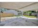 Spacious carport area offering covered parking and access to the home at 1308 Oregon St, Orlando, FL 32803